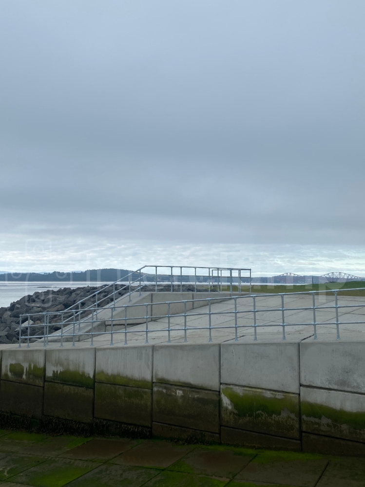 Interclamp galvanised three rail modular system installed on a sea front